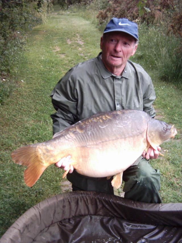 Ted Merrinin, who sadly passed away. Here he has a carp even bigger than Monica.